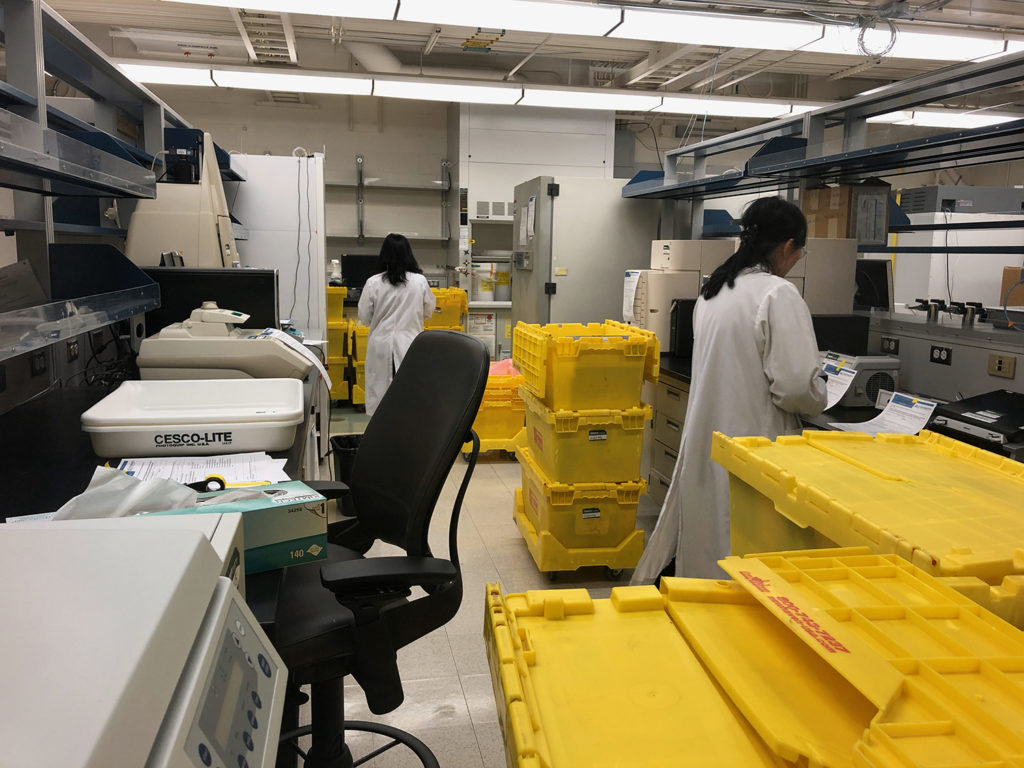 scientists packing up boxes