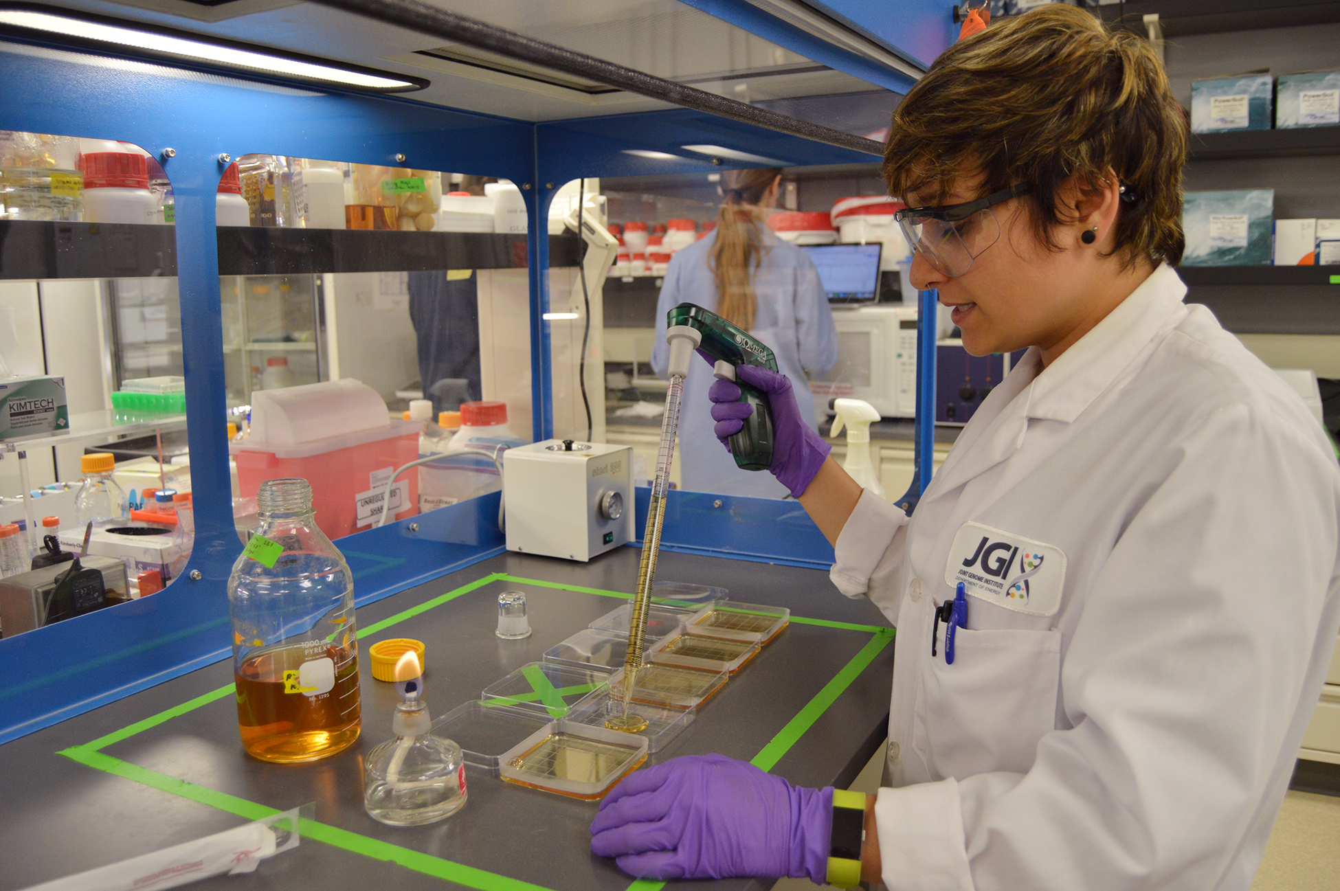 person working in a lab with lab gear