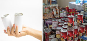 a hand holding a cup next to several cans