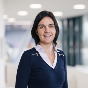 Headshot of researcher standing in a hallway