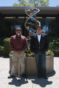 intern and mentor in front of a statue