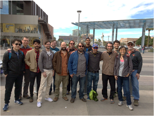 a group shot of people in a parking lot