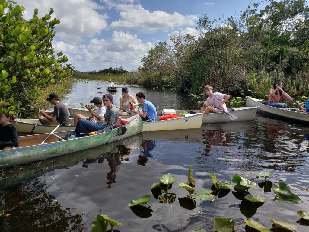 people in boats in water