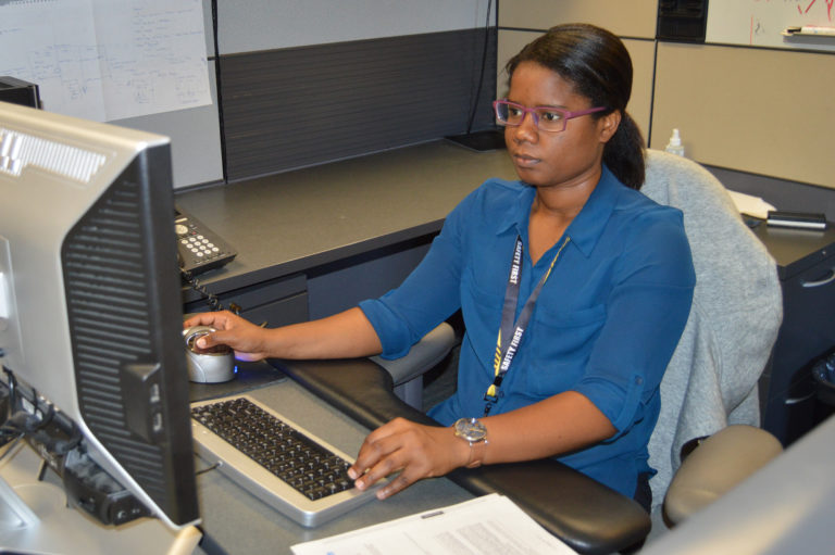 an intern working at their desk on their computer