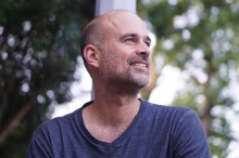 a headshot of a person looking to the right