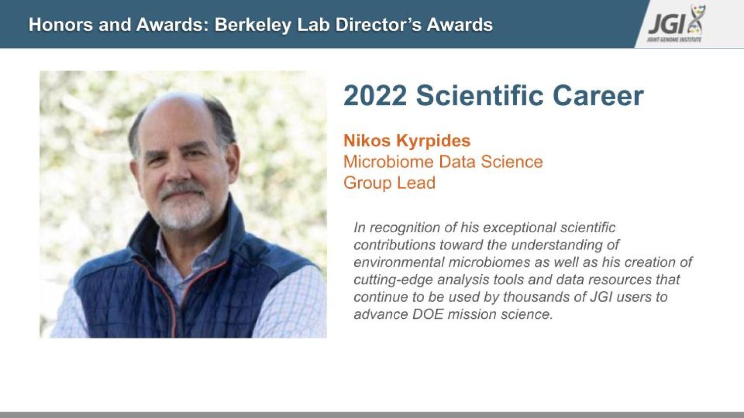 A slide includes a headshot and honors Nikos Kyrpides receiving the 2022 Scientific Career award.