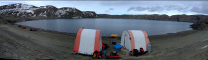 Photo: Deep Lake as an expedition work site in November 2008, shown with mobile work shelters and equipment for sampling. (Courtesy of Rick Cavicchioli)
