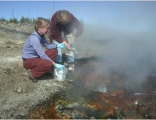 Niki Parenteau (left) and Beverly Pierson (right) sample red-layer phototrophic mats at Fairy Geyser, August 2007 (Image courtesy of Bill Inskeep)