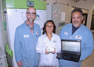 The JGI Freezer Challenge Team (left to right): Tom Vess, Christine Naca and Don Miller in front of two freezers being monitored by the Klatu system. As part of JGI’s efforts to become more sustainable, Stirling freezers like the one on the left are being phased in because they use less than half of the energy consumed by the older freezer on the right.