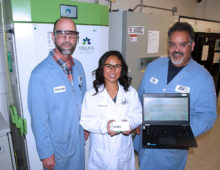 The JGI Freezer Challenge Team (left to right): Tom Vess, Christine Naca and Don Miller in front of two freezers being monitored by the Klatu system. As part of JGI's efforts to become more sustainable, Stirling freezers like the one on the left are being phased in because they use less than half of the energy consumed by the older freezer on the right.