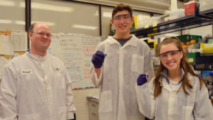 JGI’s Robert Evans (left) with students Tim Kostolansky (center) and Maya Hanck (right).