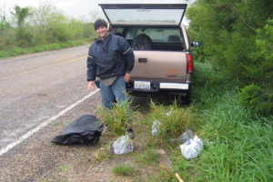 Man in front of truck with bagged switchgrass plants. This is from one of many switchgrass collecting trips around the state of Texas in 2010. (David Lowry)