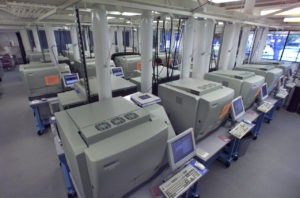 A room with four rows of sequencing machines.