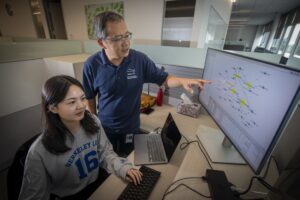 Yuguo Tang (seated), SULI Summer 2023 Intern, works with mentor Zhong Wang at the Integrative Genomics Building (Building 91), at Lawrence Berkeley National Laboratory (Berkeley Lab), 08/03/2023.